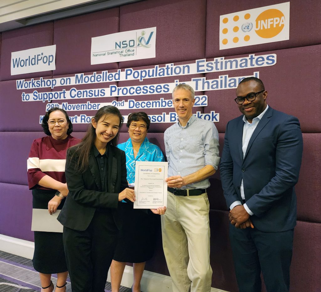 Photo of Ms Nipapan Borompichaichatkul receiving a Workshop on Modelling Population Estimates to Support Census Processes in Thailand certificate from Professor Andy Tatem