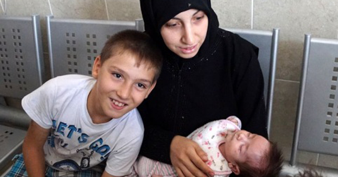 Photo of woman with two children