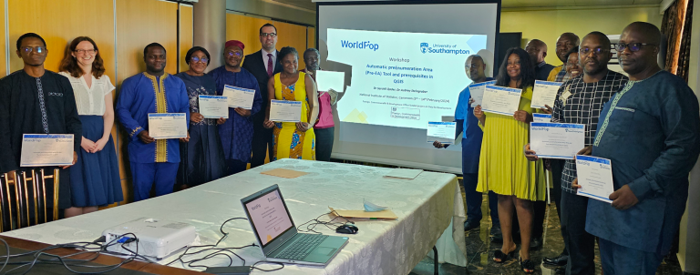 Workshop participants holding completion certificates