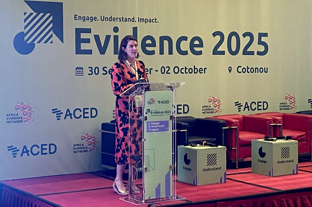 Photo of Dr Jessica Espey, Deputy Director (Research) delivering the Day 2 keynote address at Evidence25, Cotonou, Benin