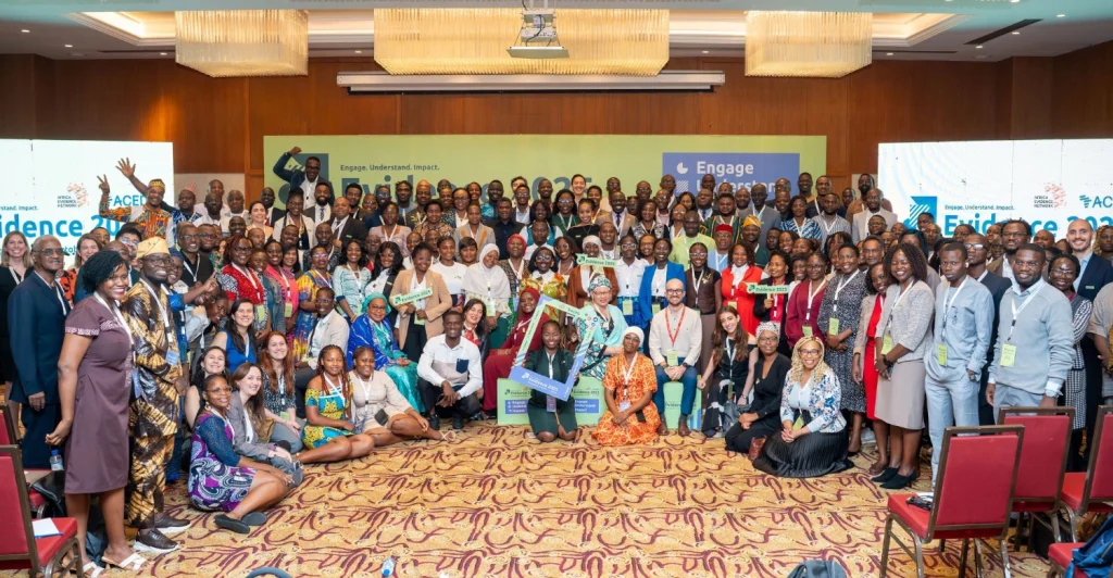 Photo of speakers and delegates at Evidence25