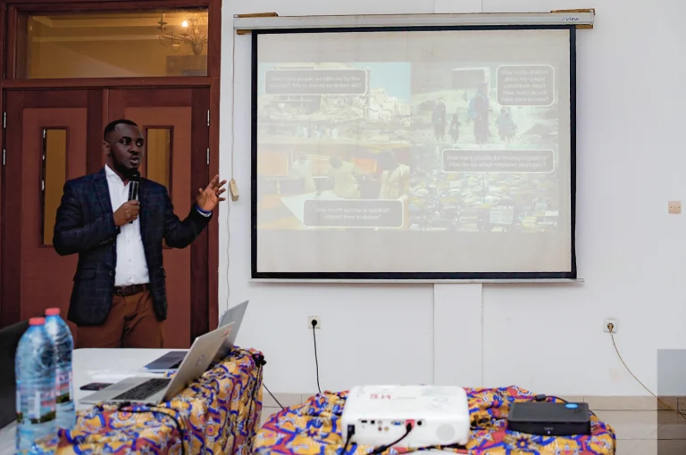 Photo of Dr Ortis Yankey leading a hybrid census workshop.