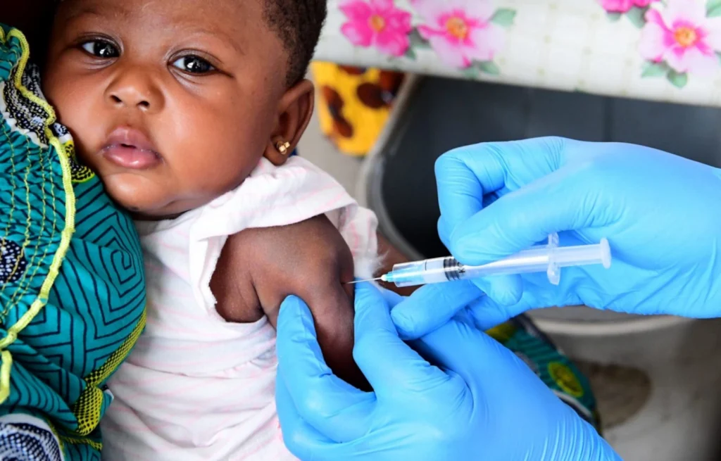 Photo of baby being vaccinated.