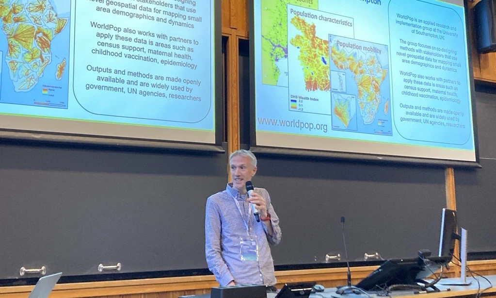 Photo of Andy Tatem presenting at DAC2026