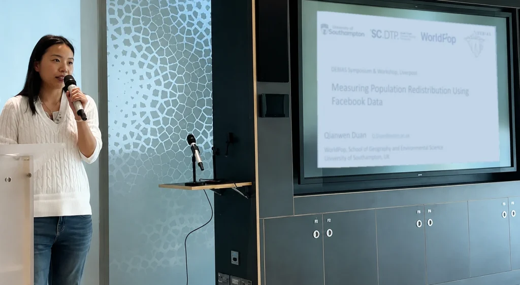 Photo of Qianwen Duan presenting at DEBIAS 2026