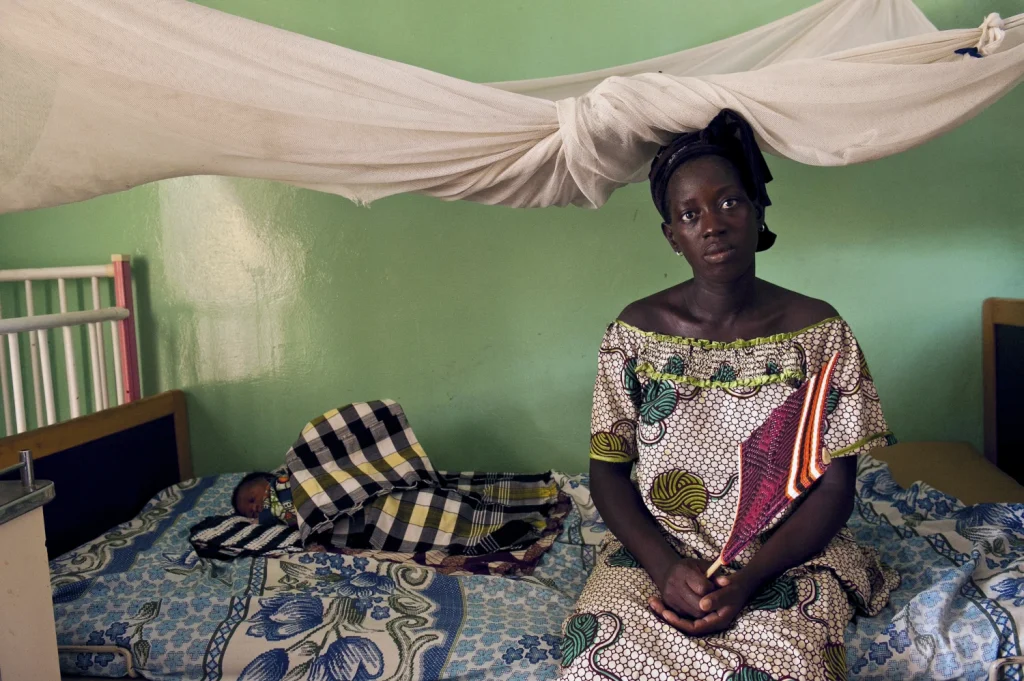 Photo of Mother and daughter with bed net