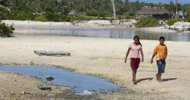 Photo of Locals in Tebikenikora, a village in the Pacific island nation of Kiribati.