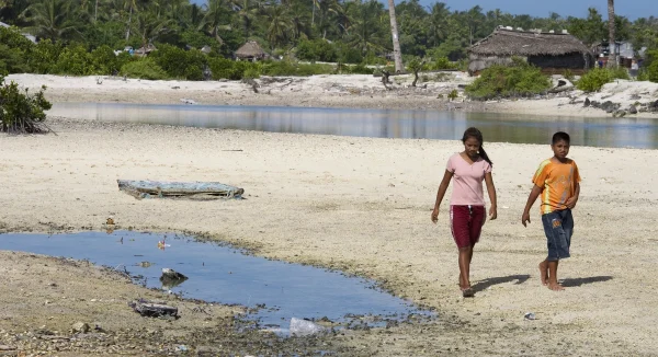 Photo of Locals in Tebikenikora, a village in the Pacific island nation of Kiribati.