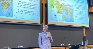 Photo of Andy Tatem presenting at DAC2026