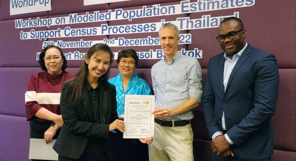 Photo of Ms Nipapan Borompichaichatkul receiving a Workshop on Modelling Population Estimates to Support Census Processes in Thailand certificate from Professor Andy Tatem