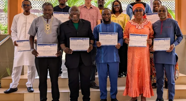 Photo of Cameroon DEGURBA workshop participants with completion certificates.