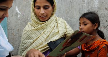 Photo of a community health worker conducting a survey in the Korail slum, Bangladesh