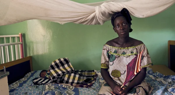 Photo of Mother and daughter with bed net