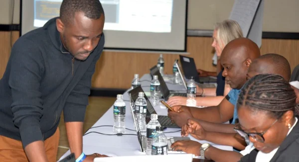 Photo of Dr Ortis Yankey supporting participants of workshop for Malawi’s 2028 Census, September 2026.