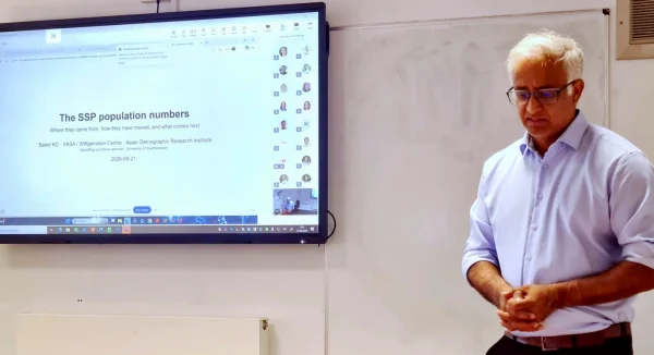Photo of Professor Samir KC presenting at WorldPop