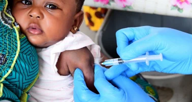 Photo of baby being vaccinated.